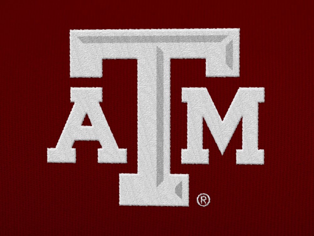 A white A&amp;M logo embroidered on a maroon shirt